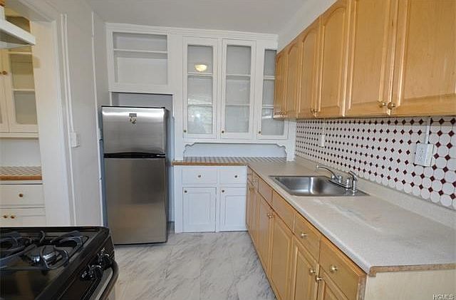 Kitchen with stainless steel appliances.