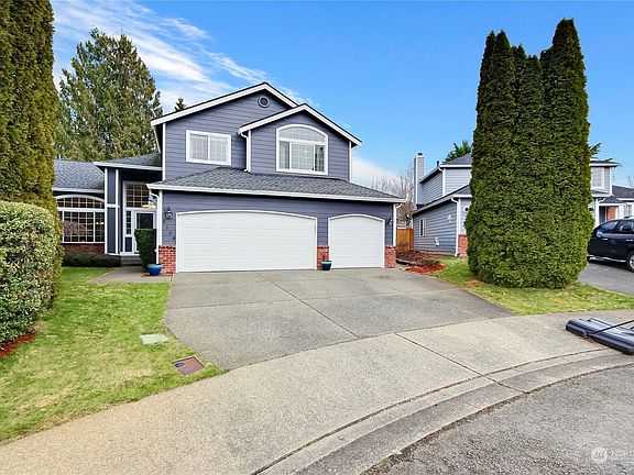 Newer exterior paint with brick accents & newer composition roofing make this home shine!  This home also has a newer furnace, AC, tankless water tank & security system. Front & back sprinkler system too & beautiful design touches & finishes thruout!>