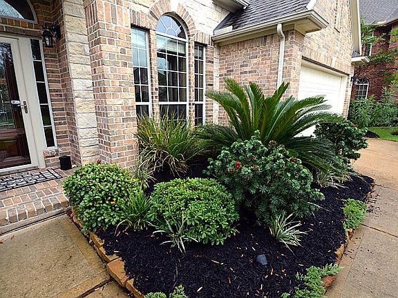Beautifully landscaped with inviting entry.