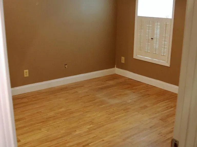 Flex room is located off the kitchen; best for office, den, guest room, or tenant-specific use.