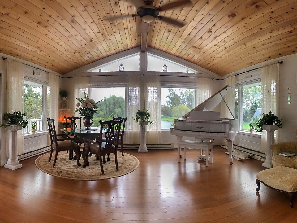 Main sunroom overlooks pond 