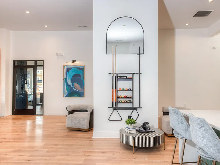 Resident amenity center featuring thoughtfully designed lounge spaces, offering a welcoming environment to gather, unwind, and connect.