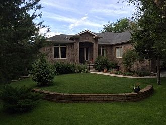 Front elevation
						:
						Front view - All brick walk-out ranch
