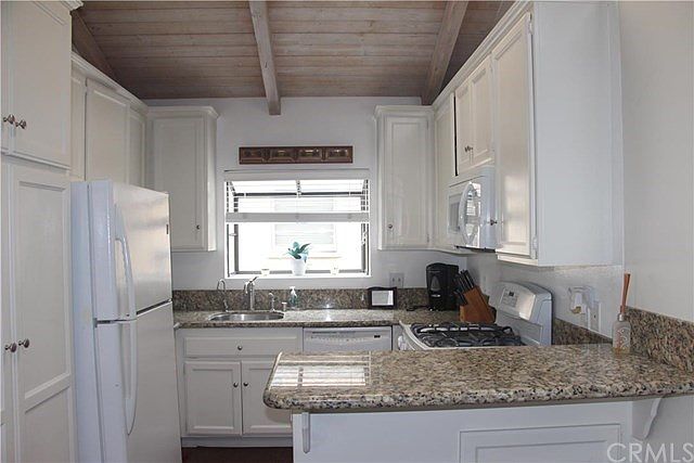 High beam ceiling and skylight bring in lots of light into t