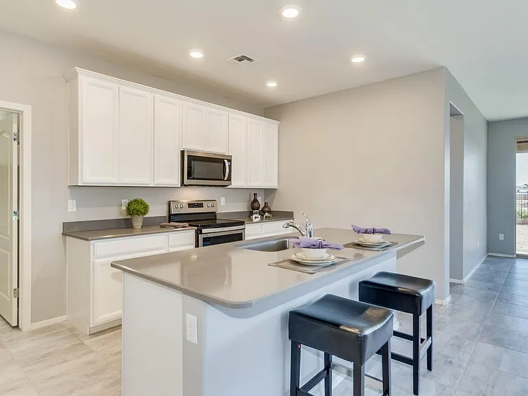 Upgraded cabinets, quartz counters, large island