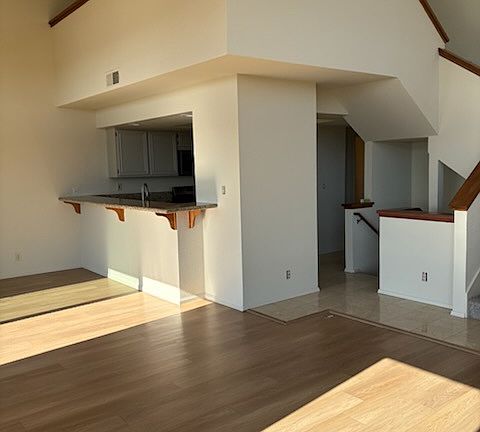 stairs to the open loft and then stairs to the bedrooms below