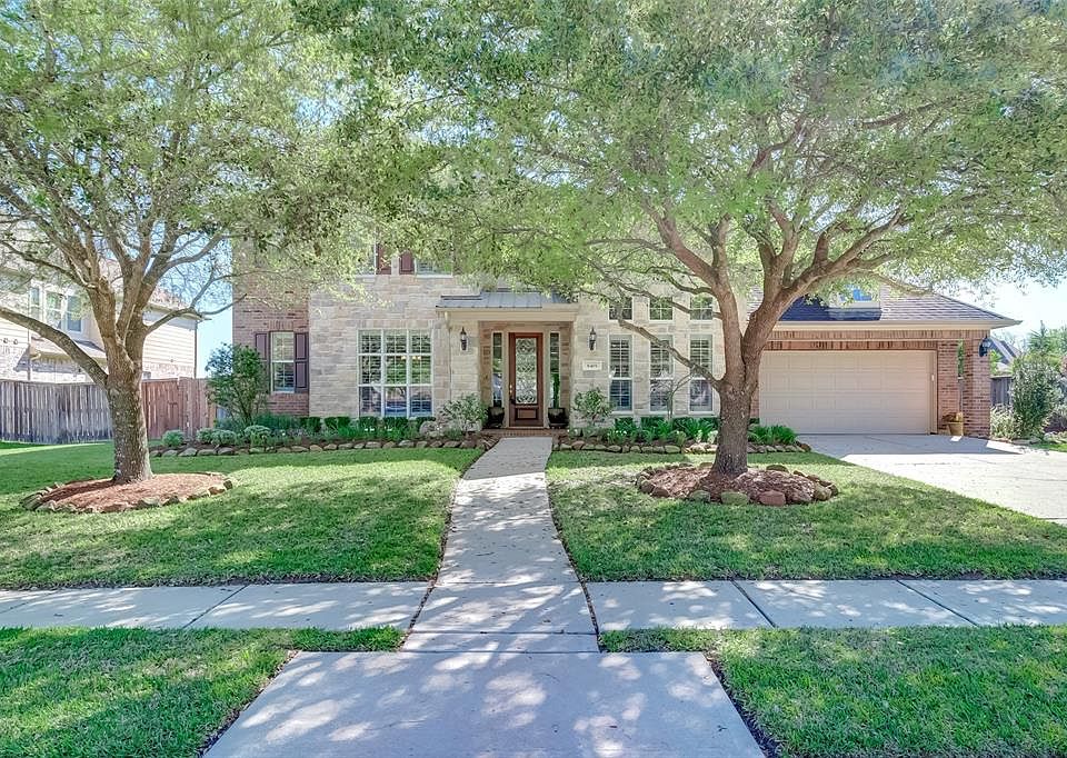 Gorgeous Village Builders home with highly desirable "Degas" floor plan (available to download under attachments). Handsome stone and brick elevation with covered porch and large picture windows enhancing the stunning curb appeal!