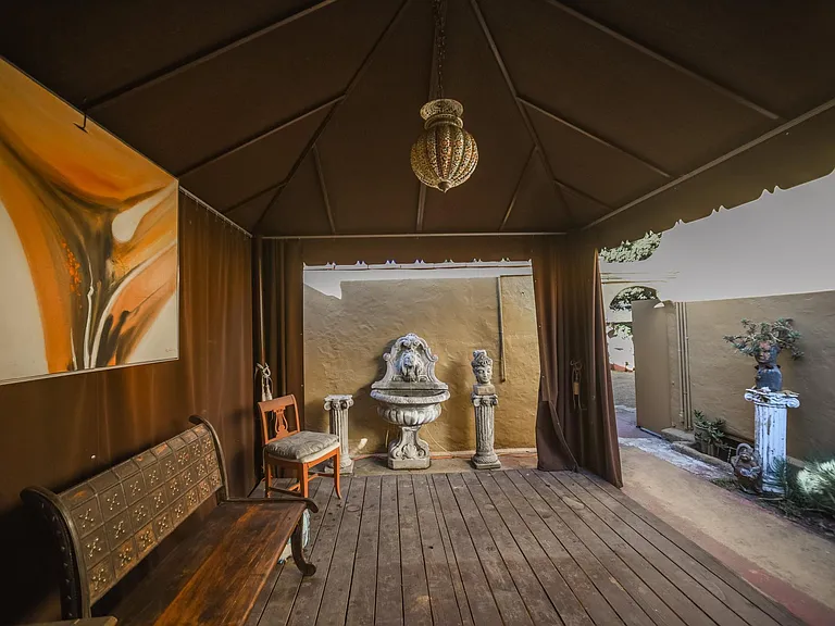 Back patio with cabana & fountain
