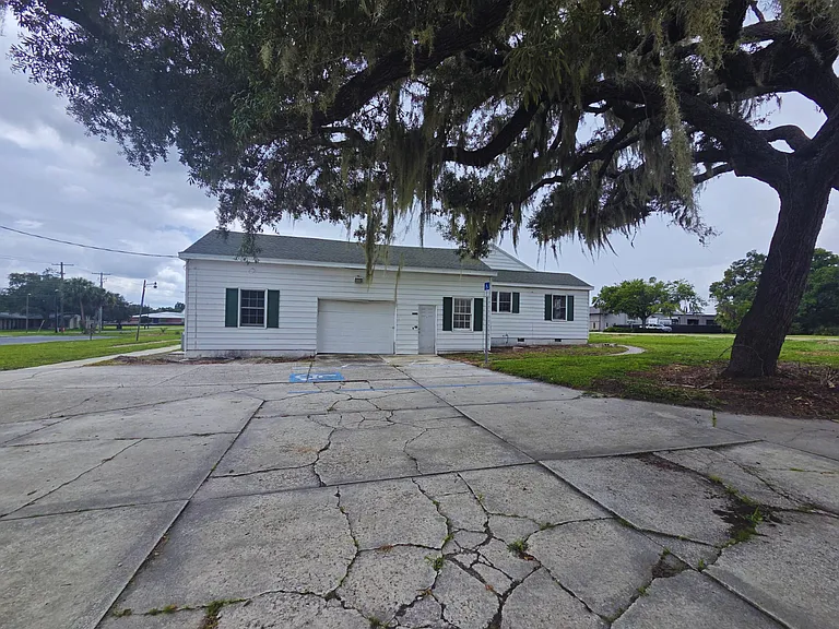 1-acre property featuring a mix of paved and natural areas