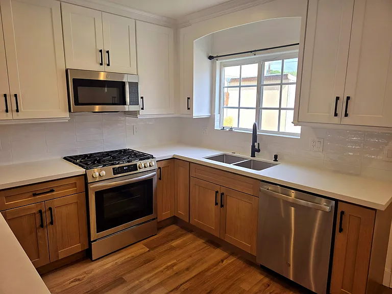 Completely remodeled kitchen with new cabinets, new countertops, new refrigerator, new stove / range, new microwave, new dishwasher, new sink, new faucet. Everything is NEW and Clean !