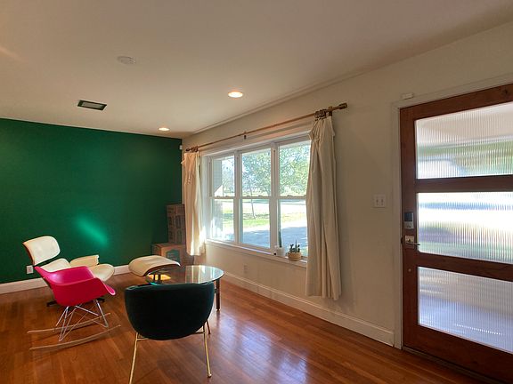 Front living area with updated windows and front door