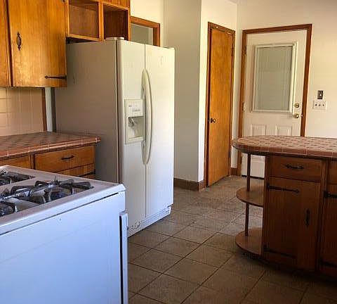 Gas stove and large refrigerator. 