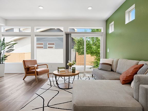 Cozy modern apartment with bright living room, comfortable sofa, and stylish decor. Perfect for relaxation and remote work. Close to parks and restaurants. Book now for a peaceful and natural stay!
