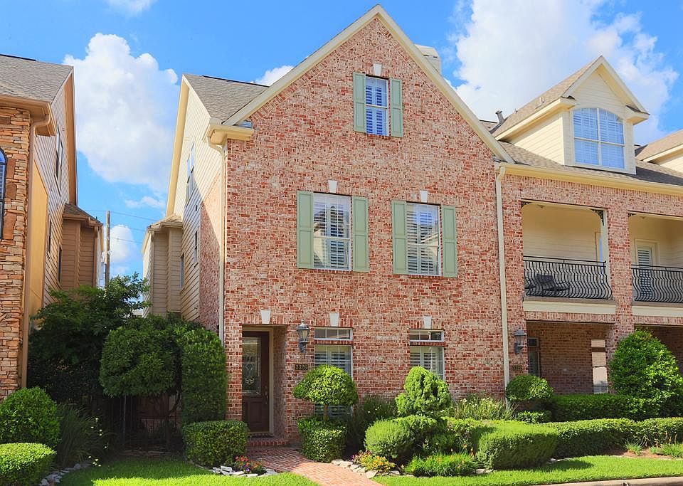 Gorgeous home encased in lovely manicured landscaping, sits inside a gated community in highly sough