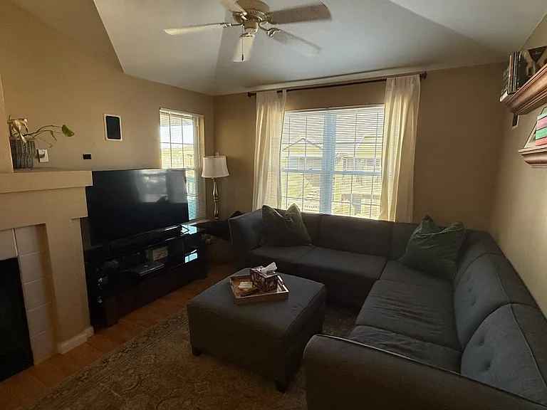Vaulted Ceilings in living room. Several windows for natural light