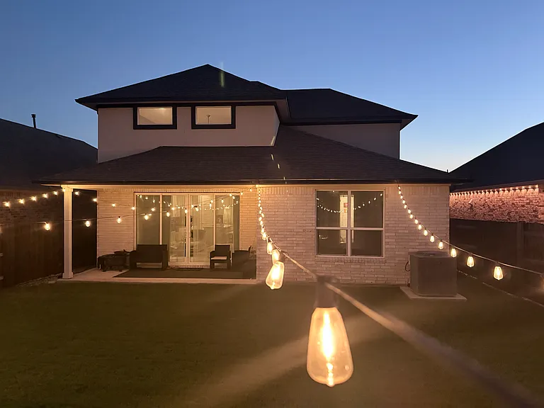 Backyard View at Night with String Lights