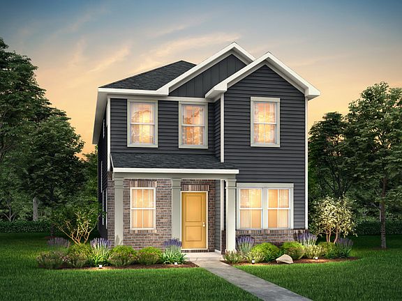 Wylie Exterior 6 features siding, brick, covered front sitting porch and 2 car rear load garage