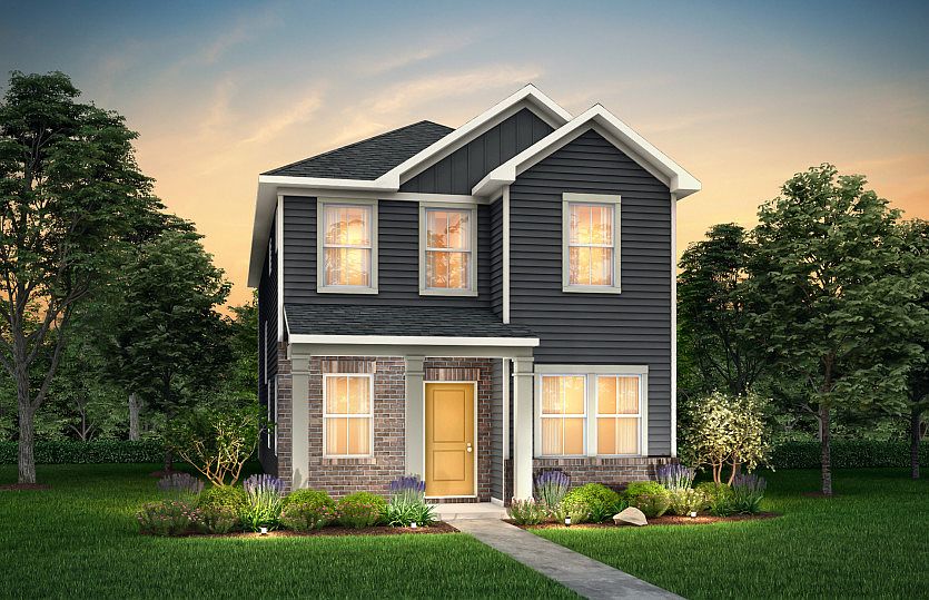 Wylie Exterior 6 features siding, brick, covered front sitting porch and 2 car rear load garage
