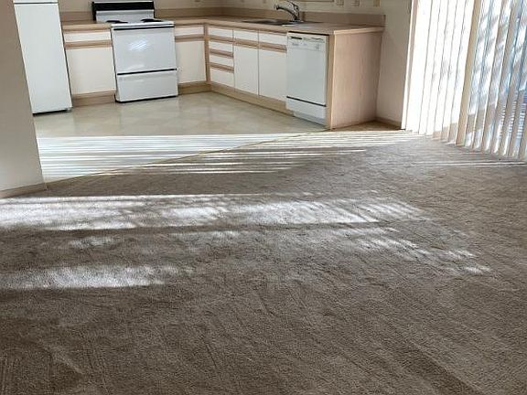kitchen with partial view of living room