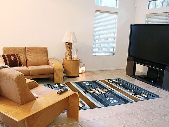 Living room with large flat screen TV. Wifi included in rent.