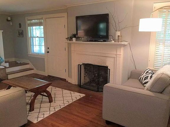 Living room, looking towards front door and working gas fireplace