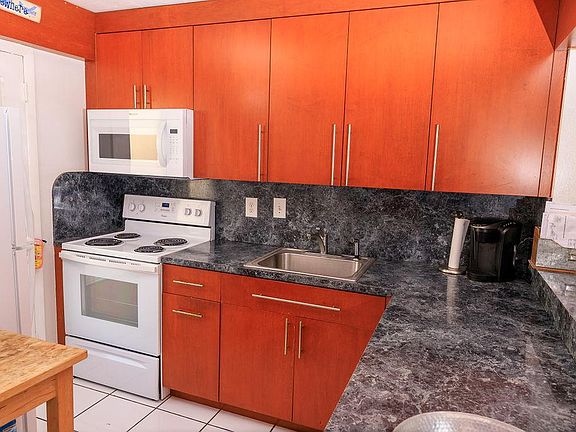 Brand new oven, microwave, and refrigerator.