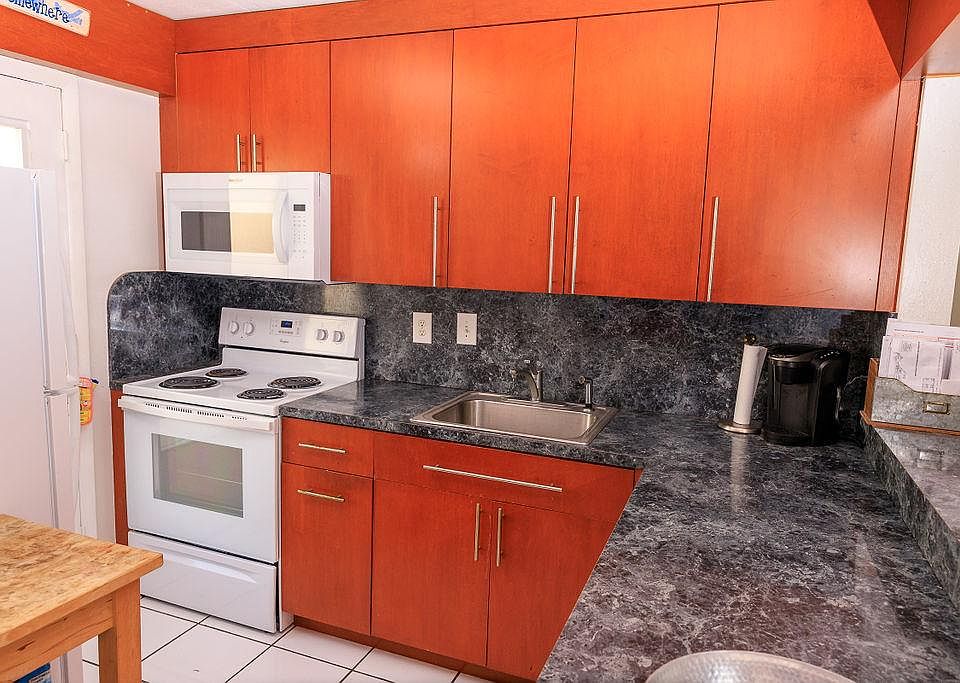 Brand new oven, microwave, and refrigerator.