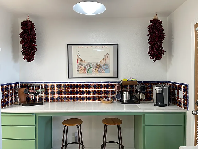 Kitchen breakfast bar with coffee, tea, and wine areas.