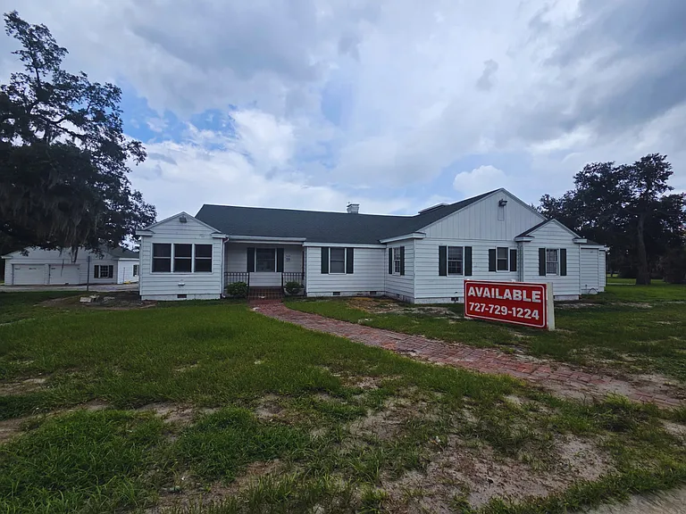 Beautiful exterior view on a spacious 1-acre property