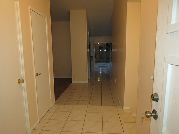 Entrance from front door. Gargage door & closet to the left, hallway right