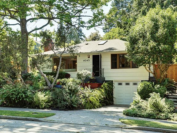 Nestled above the road and surrounded by lush greenery.