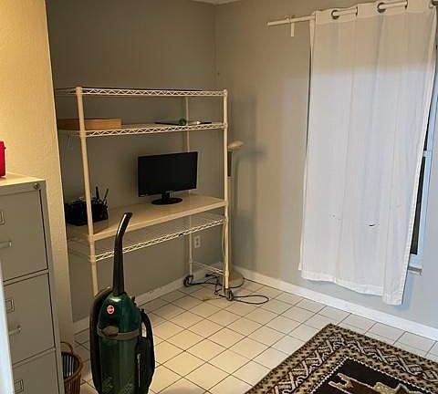 Home office (or small 2nd bedroom). A large wooden desk is not shown here but is included in the unit.