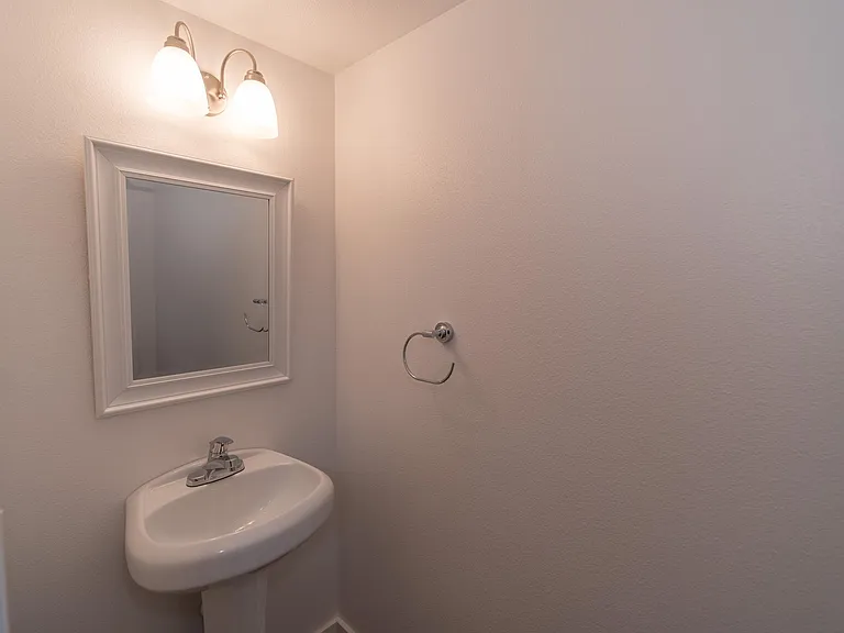 Half bathroom downstairs. Toilet on opposite side of sink.