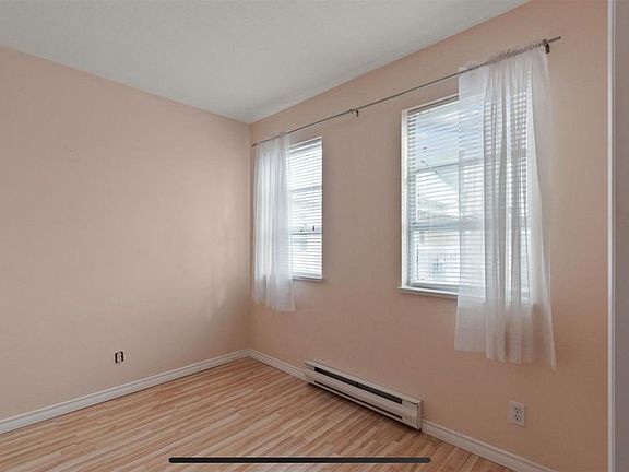 Second bedroom with 2 windows providing a light and airy feel.