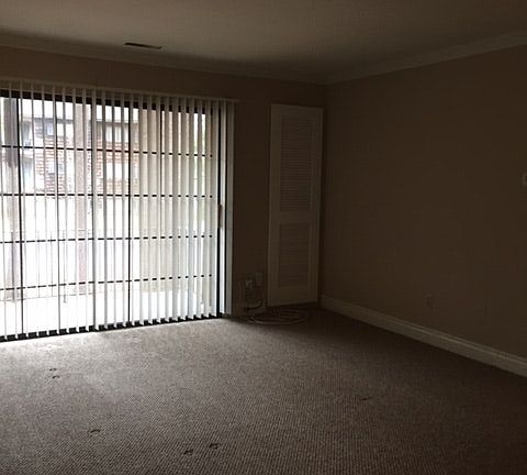 Balcony with a sliding door connected to the living room