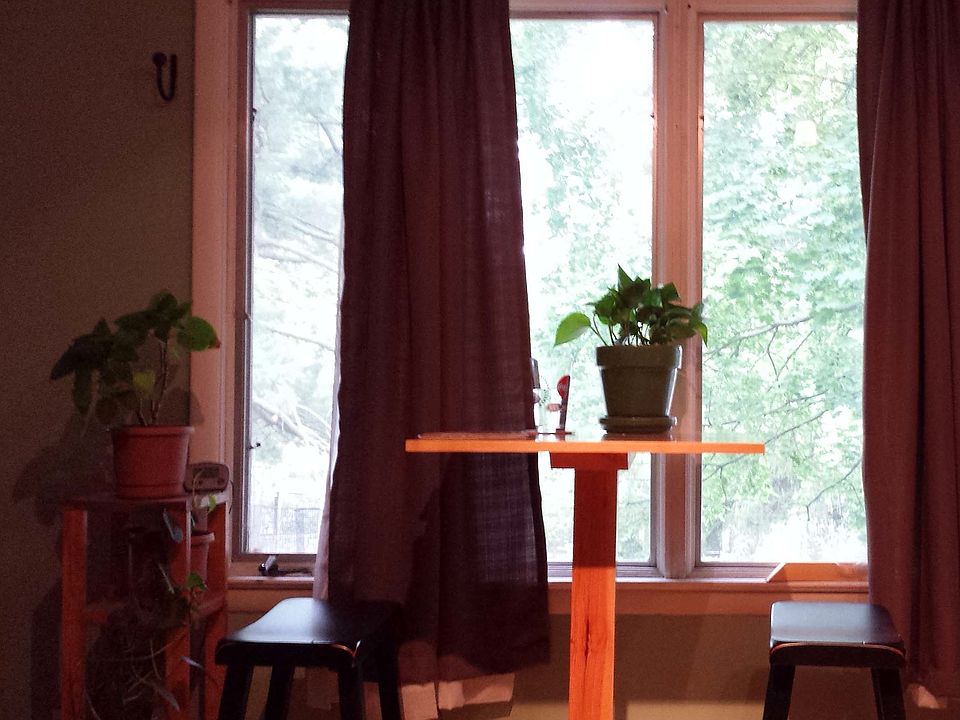Large picture windows look out over back yard.