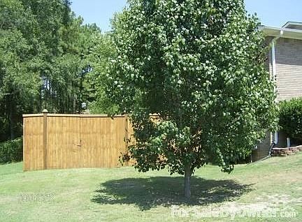 Left side of home
						:
						Bradford Tree and 8 foot Privacy Fence with 11.5
foot gate.