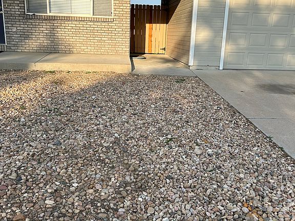 Pathway to backyard and garage