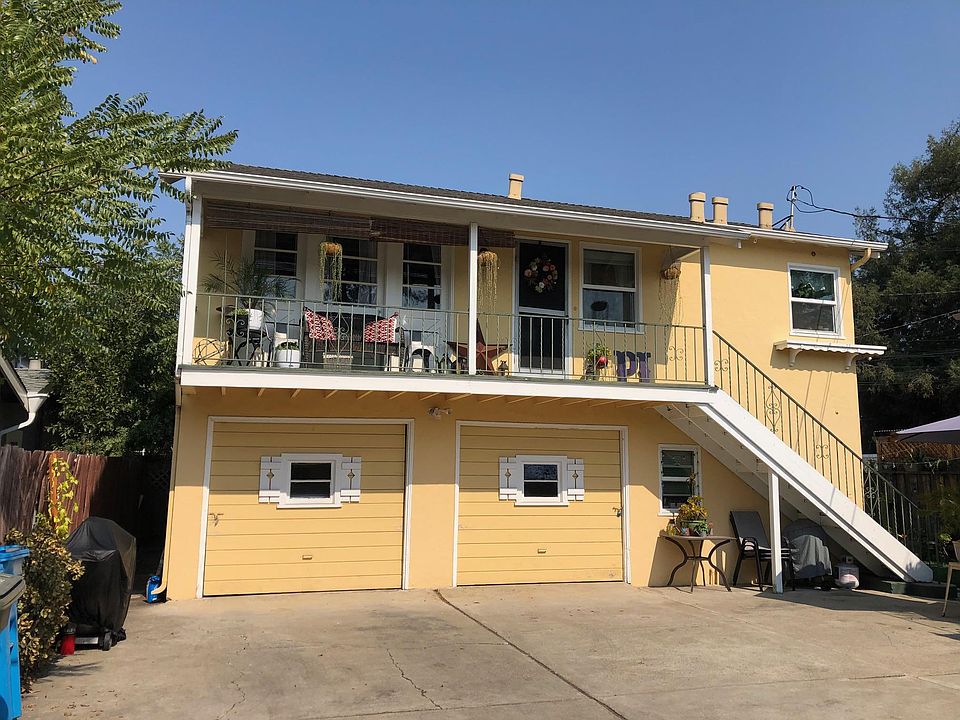Home is above the garages, See stairwell and deck, left hand garage goes with upstairs.