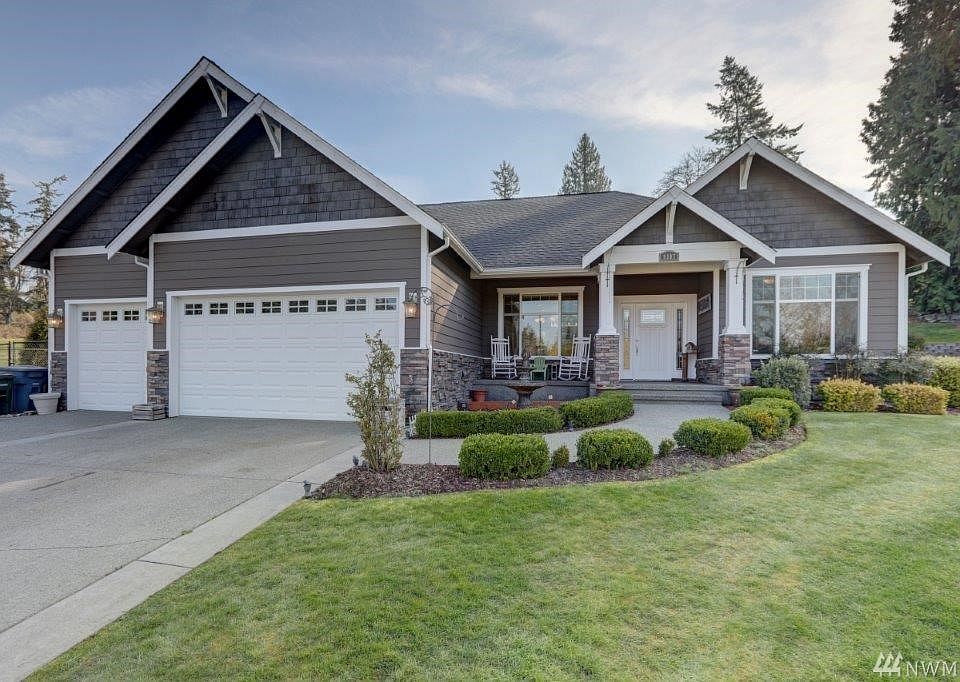 Traditional rambler with a a Rocking Chair front porch
