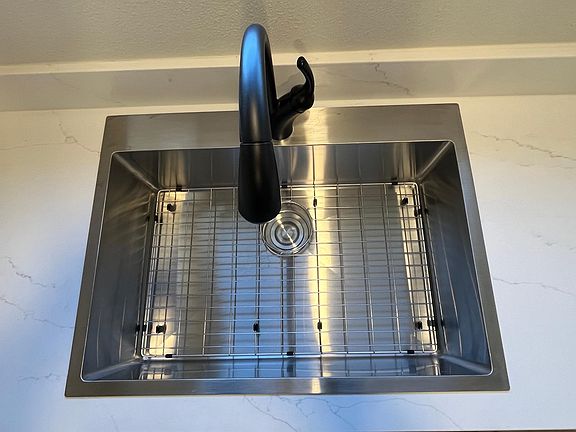 Stainless sink with luxury delta kitchen faucet