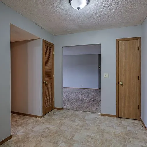 Living room entrance and storage at 108 Blondo.