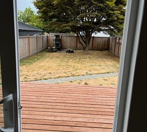 backyard deck off kitchen, fully fenced yard