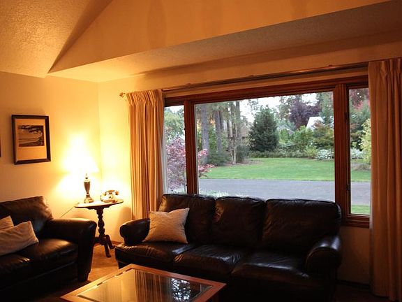 living room window. Looks out into park like setting. Stre