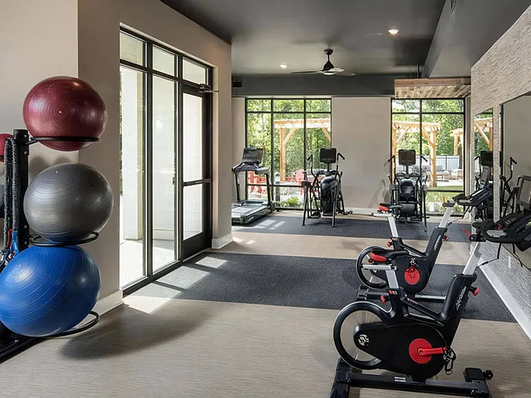 24-Hour Fitness Center with Spin Bikes, Treadmills, and Free Weights