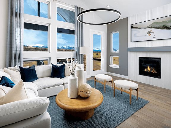 The living room features vaulted ceilings that create an open, airy feel and is conveniently located