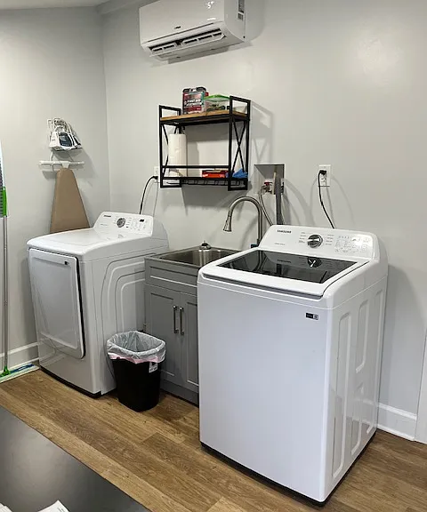 Fully equipped laundry room in the back of the property.