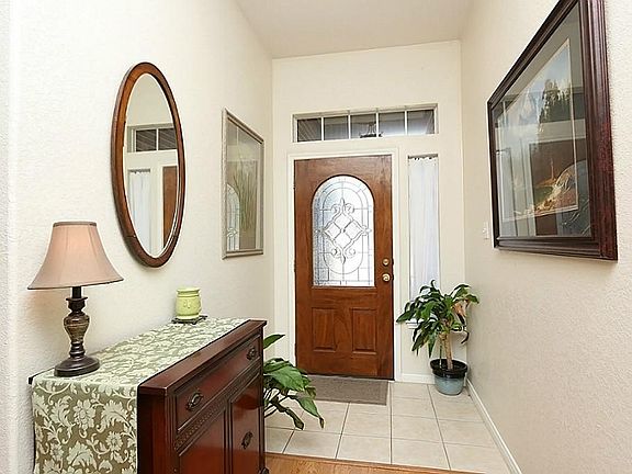 Nice & Bright foyer with custom glass designed front door!