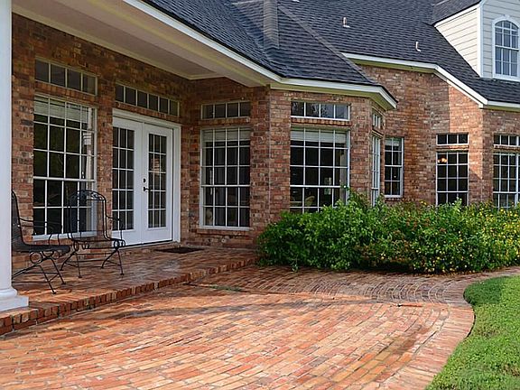 The essence of the appeal of relaxed country charm is witnessed on this covered Porch, which is just one of four.   This one is accessed from both the Family and Breakfast rooms.