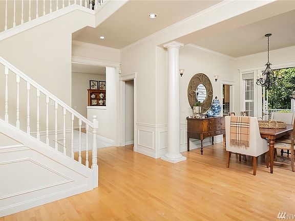 Intricate millwork and gleaming hardwoods grace the main level of this traditional home. 